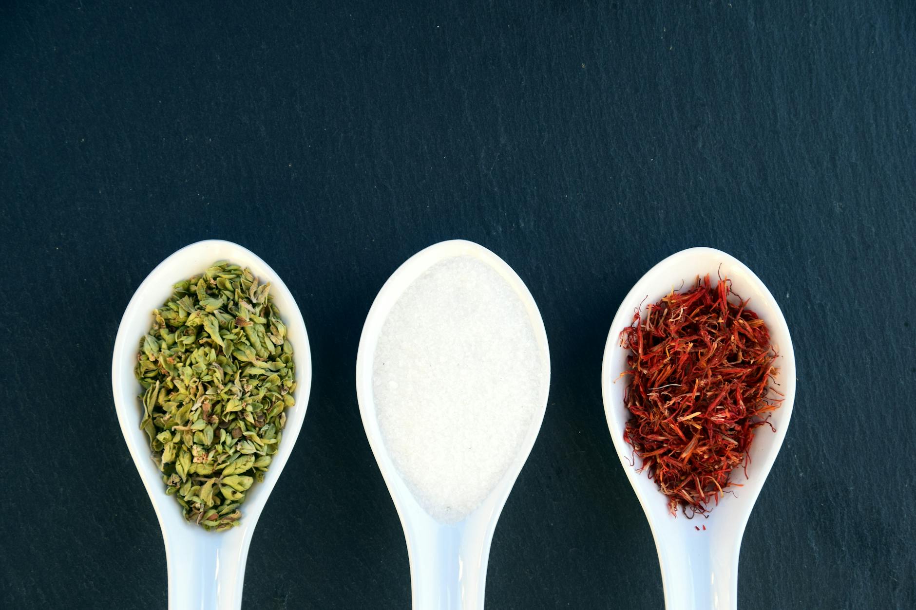 three white ceramic soup spoons - insomnia saffron